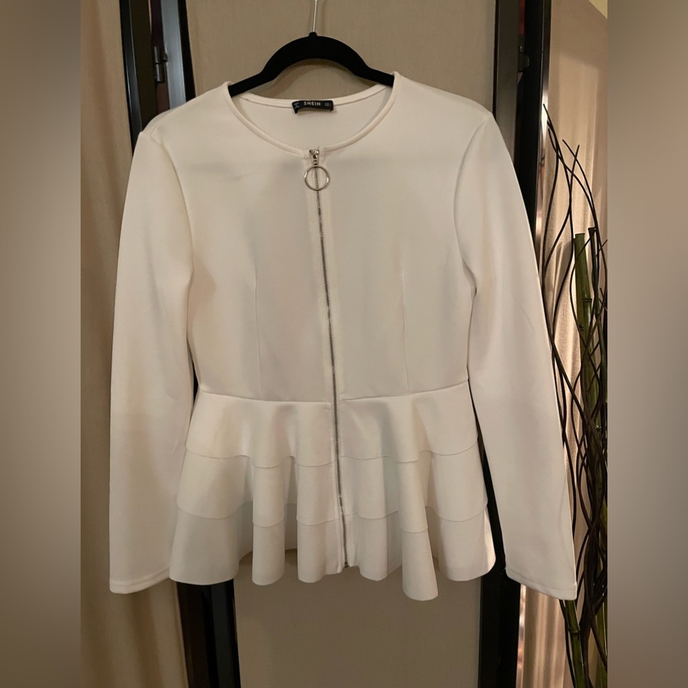 Zippered front top with three peplum layers & a rounded collar.  Size large.